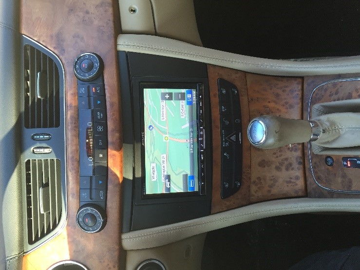 Wood trim dashboard with GPS navigation display